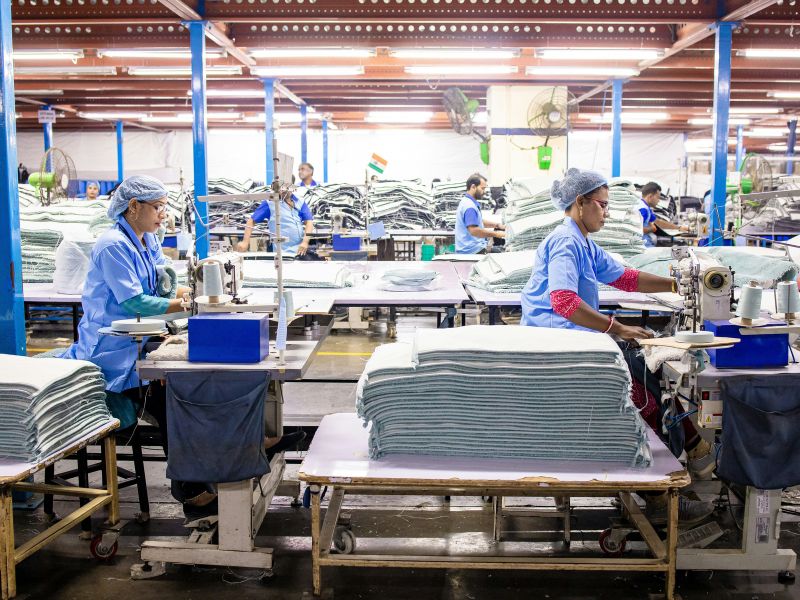 Assembly line workers sewing
